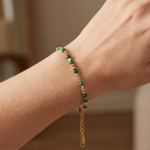 An elegant green and gold beaded bracelet, a green agate stone bracelet.